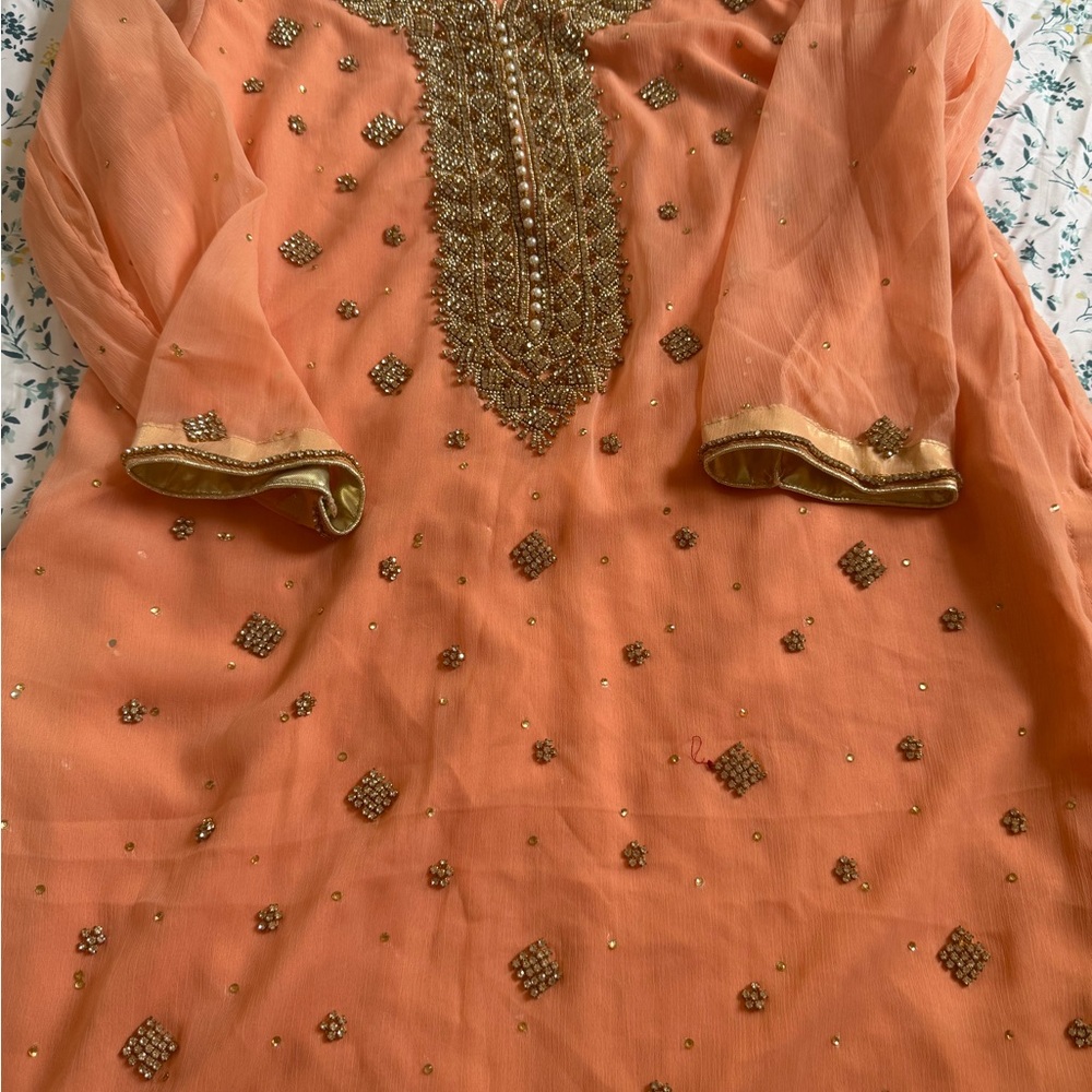 Embellished stone and pearl peach salwar suit